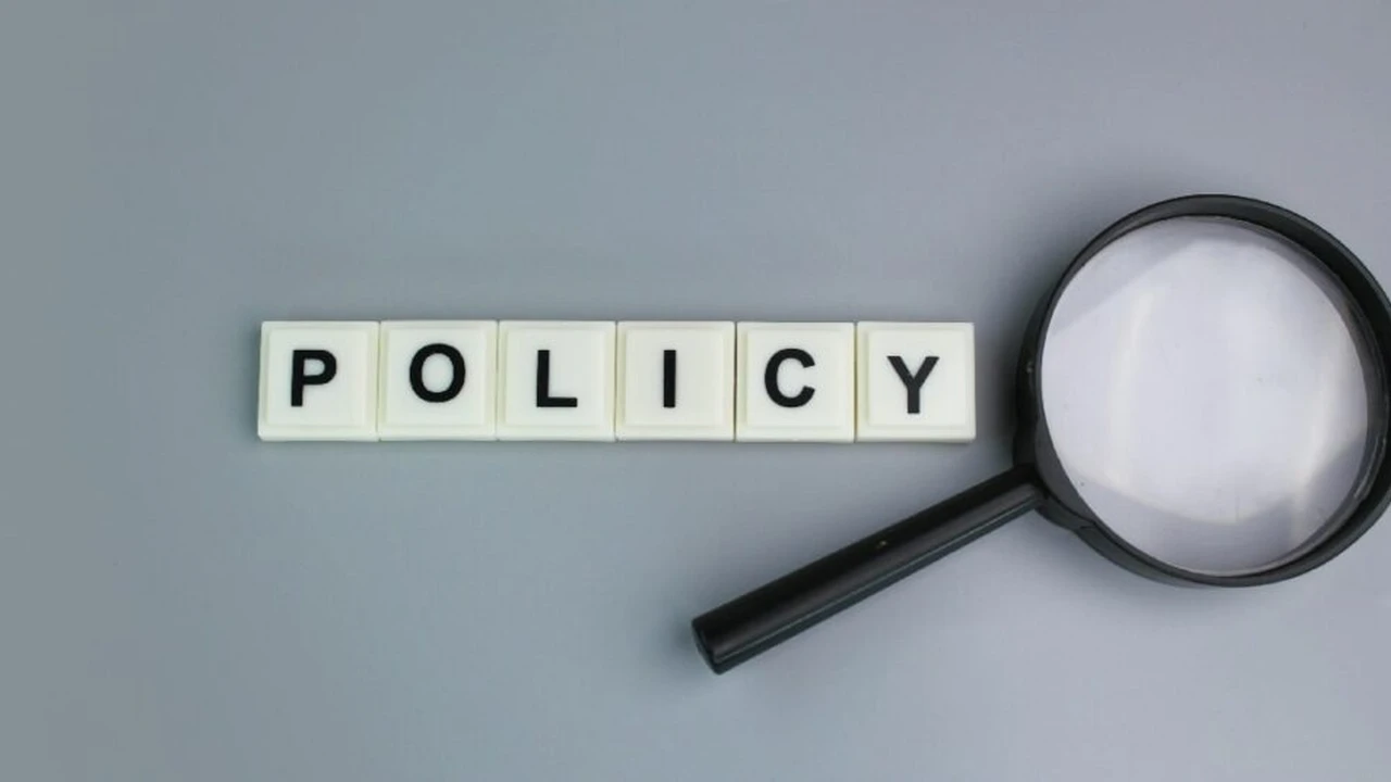 Close up on a plate of mashed potatoes, topped with baked pork chops with cream of mushroom soup, and a side of green beans.