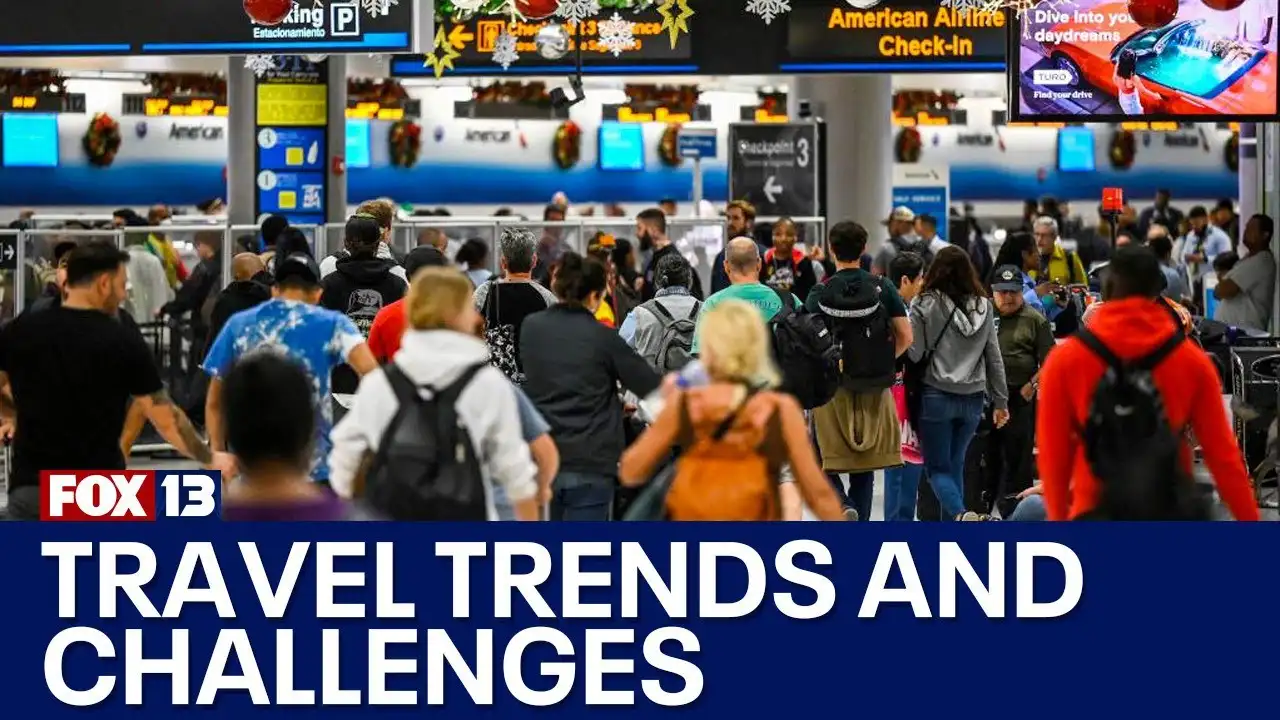Close up on a plate of mashed potatoes, topped with baked pork chops with cream of mushroom soup, and a side of green beans.